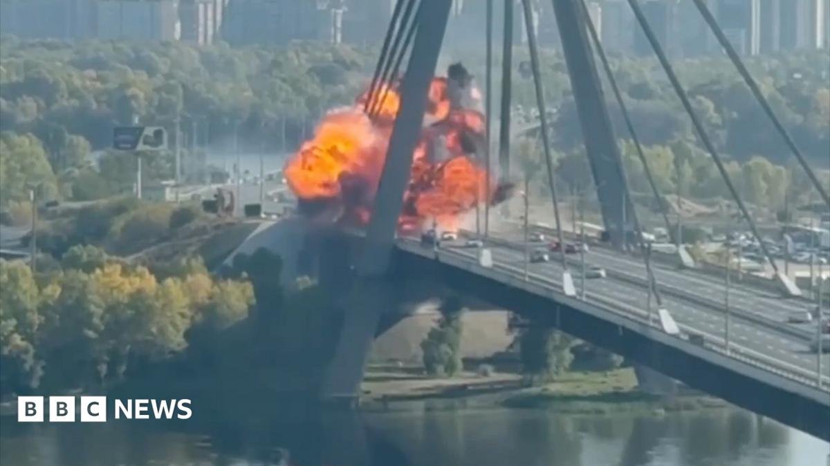 Kyiv bridge hit in further Russian drone attack as German chancellor makes surprise visit