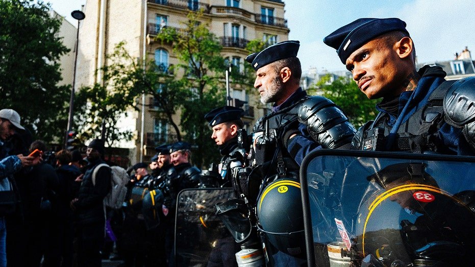 France on edge with 70,000 police deployed for unrest as authorities probe suspected terror attack near Paris